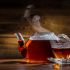Glass teapot with tea and lemon
