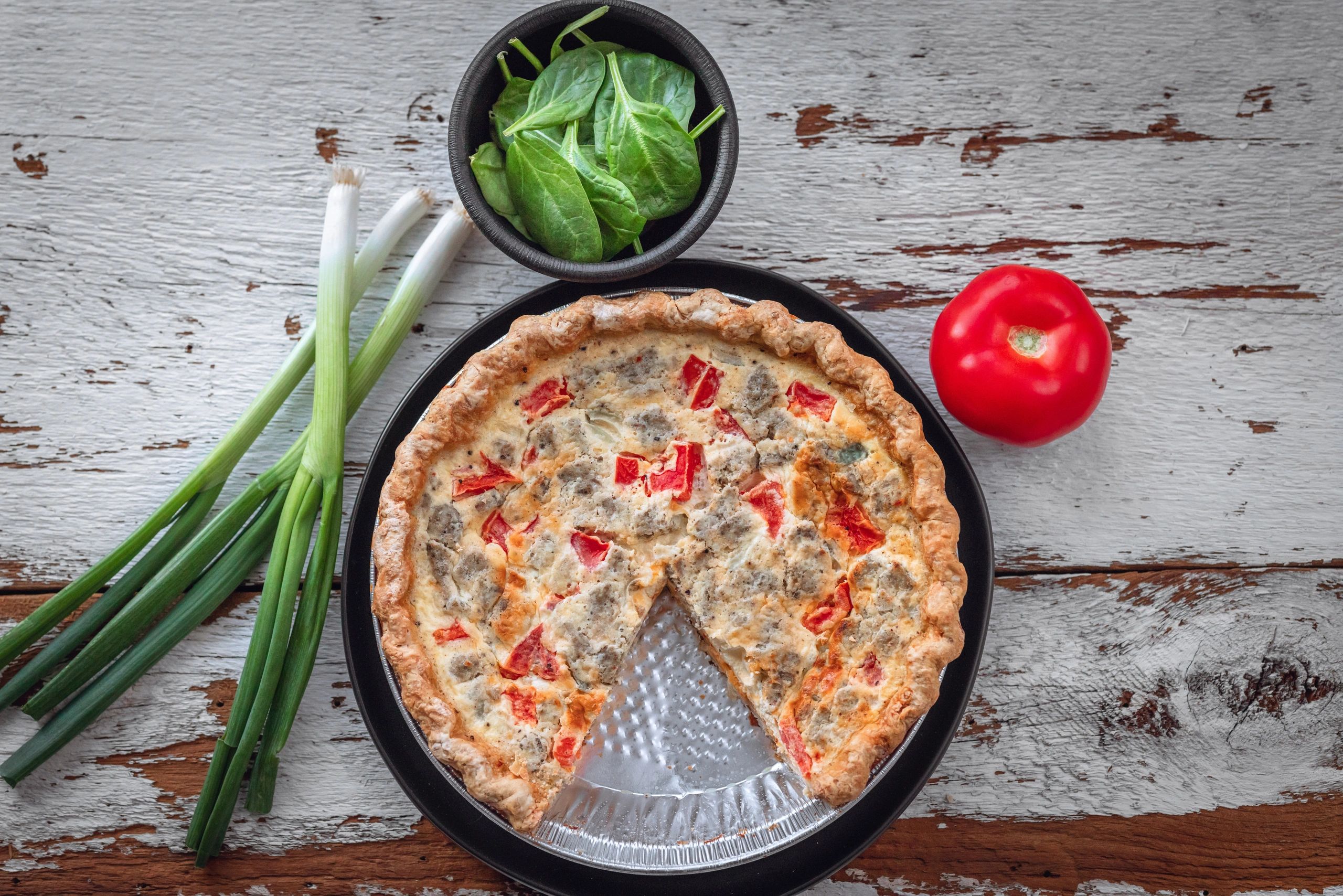 Savory quiche on rustic surface